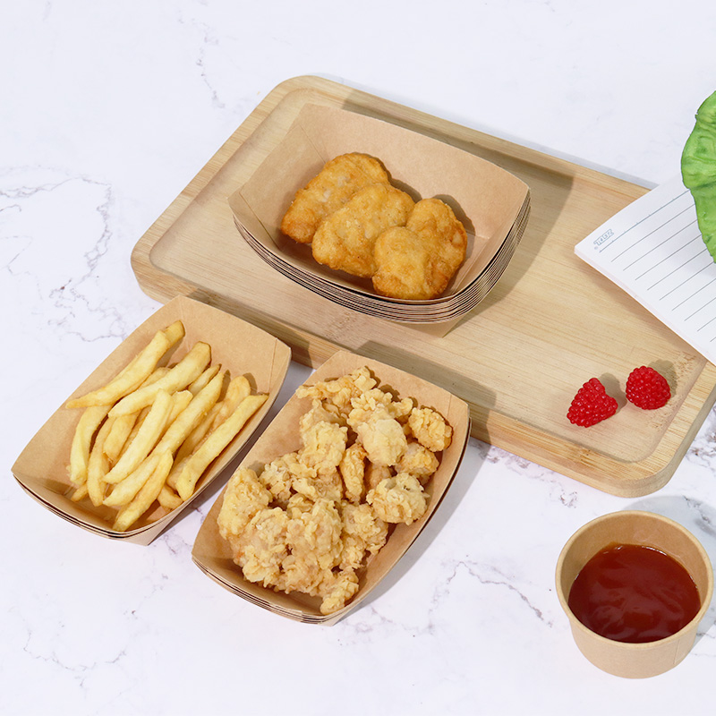 Grease-resistant paper boat trays with fries and nuggets